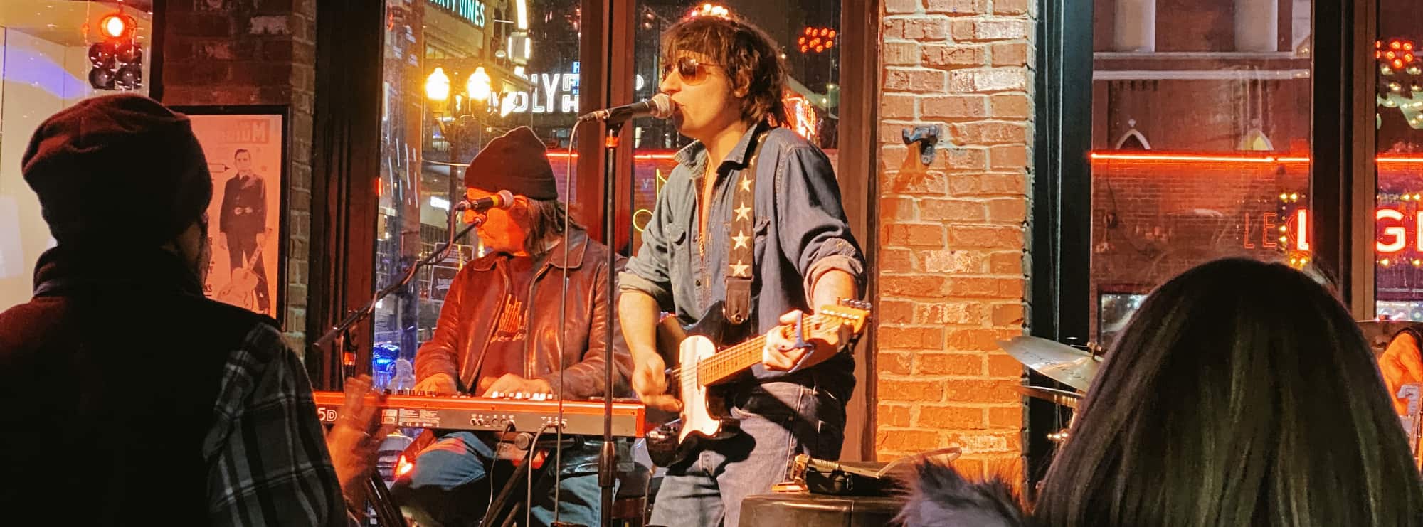 bar singer on guitar in Grand Rapids