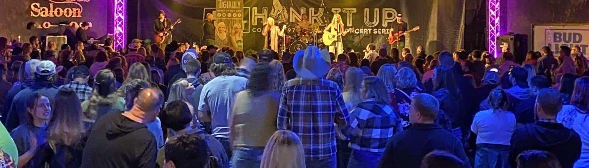 country concert with fans wearing cowboy hats Grand Rapids