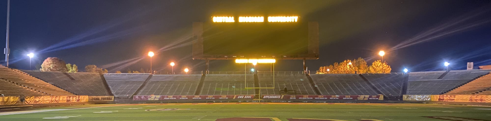 empty football stadium at night under the lights Grand Rapids