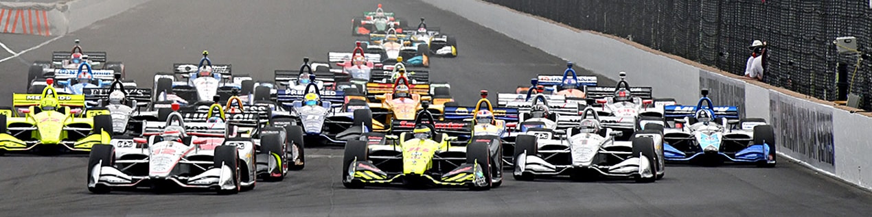 indy cars racing to through the start line Grand Rapids
